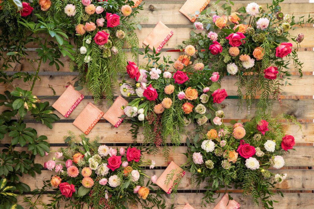 xo bloom decorated wedding floral wall