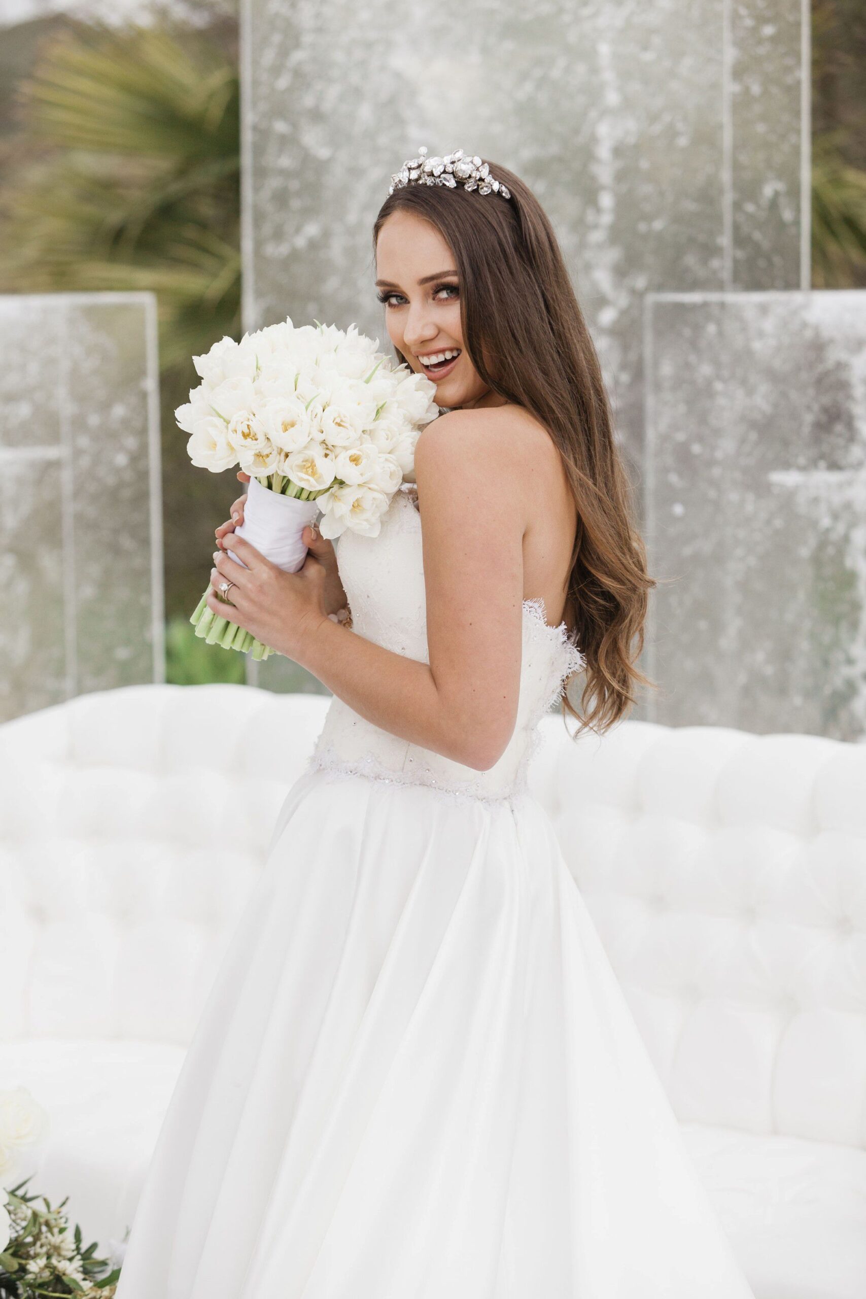 Bride hold white roses bouquet